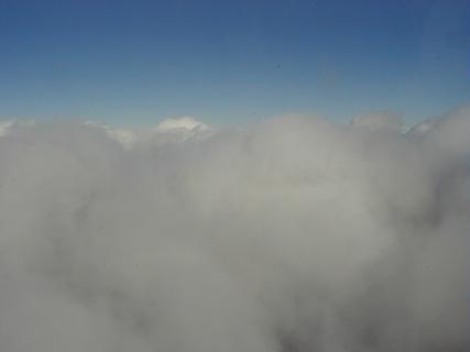 Flying through the clouds coming in for landing.  You kinda had to be there for this one - being in the middle of these huge clouds was fantastic, like flying through huge gorges or something<br>Location: Over California